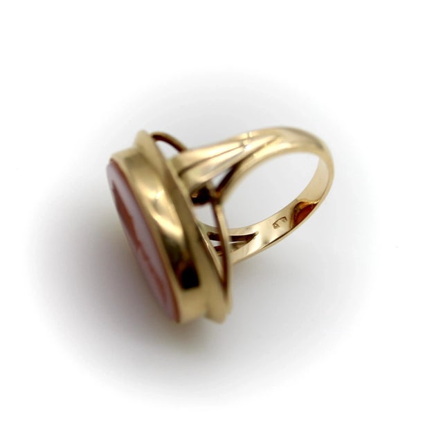 This is part of Chairish’s Fine Jewelry assortment. Set in 14k gold, the banded agate intaglio ring is hand-carved with a...