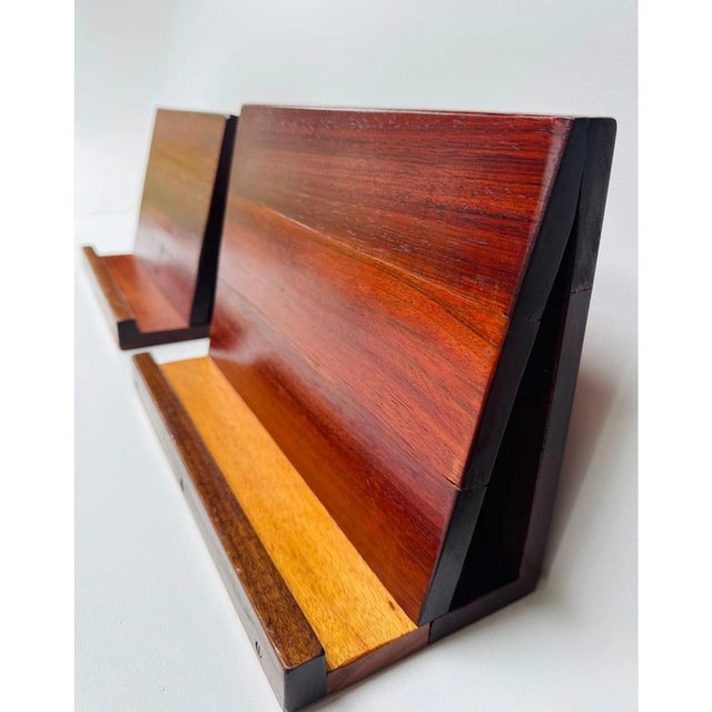A beautifully made pair of handmade wooden display stands dating to the mid-century era, likely crafted by a skilled...