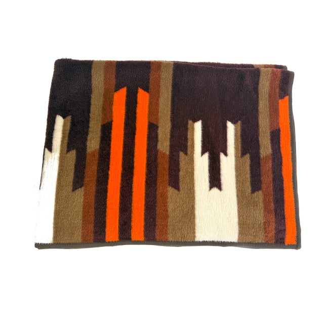 Beautiful vintage Southwestern-style plush throw blanket featuring bold geometric striping in rich earth tones of...
