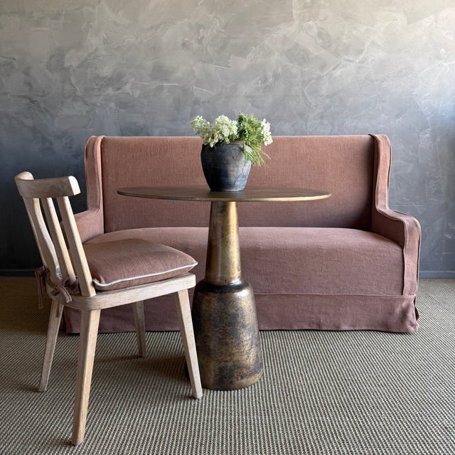Aged Patina brass finish, this table works well as a bistro table, or use as an entry center table. The top has a...