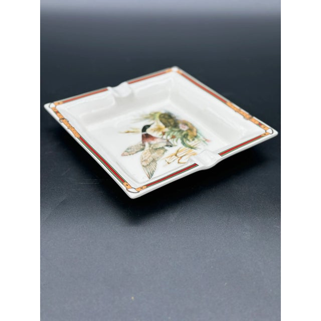 Vintage 1980s Italian ceramic ashtray by Gucci, featuring elegant design and iconic craftsmanship.