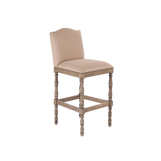 The Aria Bar Stool from Zentique is a French country bar stool with a padded linen-cotton seat on a recycled oak frame...