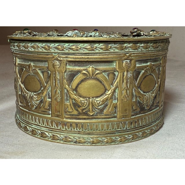 This antique 19th century Austrian petit point embellished cylindrical casket box is a handmade piece from Austria. The...