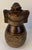Vintage carved wooden vessel featuring an intricate turtle finial and hand-carved geometric patterns throughout. The warm,...