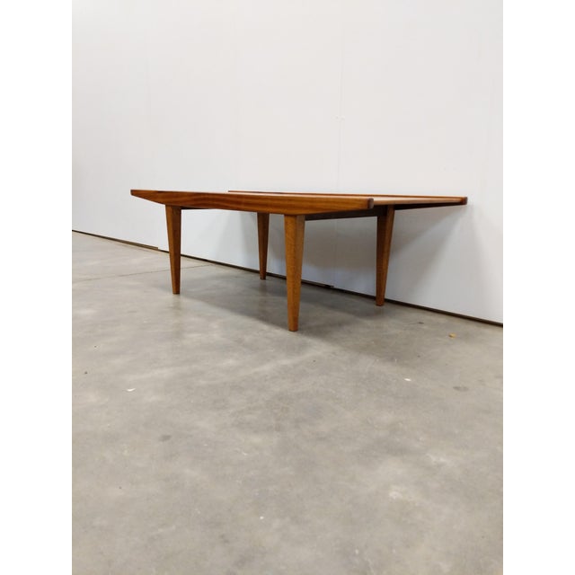 Authentic vintage mid century modern teak coffee table. By Wrighton Furniture. Maker's brand on bottom. This piece is in...