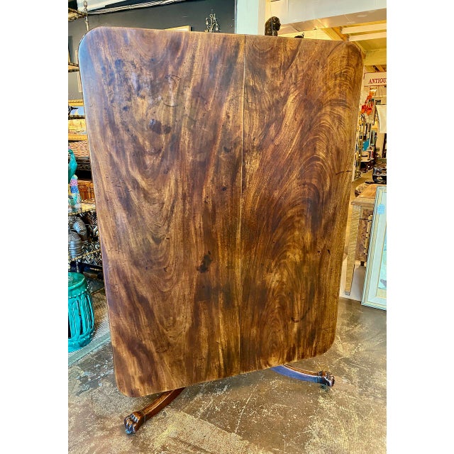 This is a large English Regency tilt-top breakfast table. The two board solid mahogany top is well-grained and in overall...