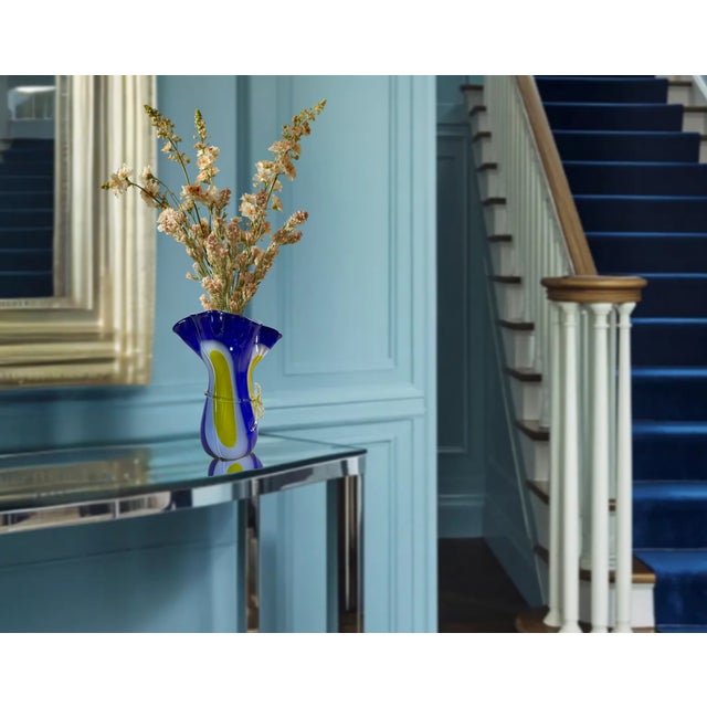 This stunning vintage Murano-style art glass Fazzoletto style handkerchief vase is a vibrant centerpiece that beautifully...