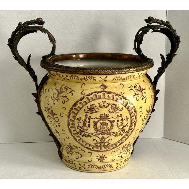 Vintage (1980's) Large Planter/Urn has a Baroque Style. Made of Ceramic with Bronze Ormolu. Mustard and Brown Color. The...