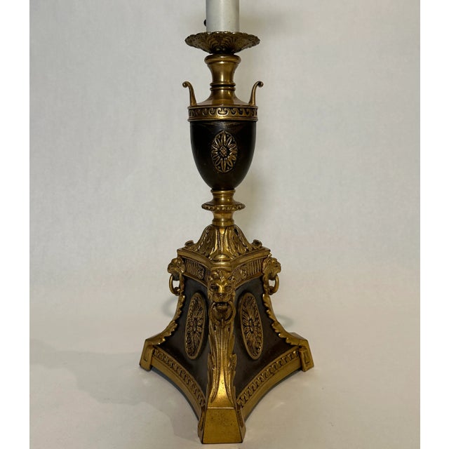 Fine quality gilt and patinated table or desk lamp. Elements include oval rosettes on the flat panels of a three sided...