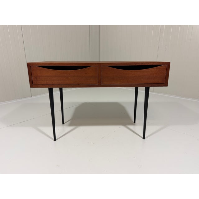 Lovely small sideboard / console table by Asko, Finland (marked). 2 Drawers wirh nice shaped handles, black steel legs....