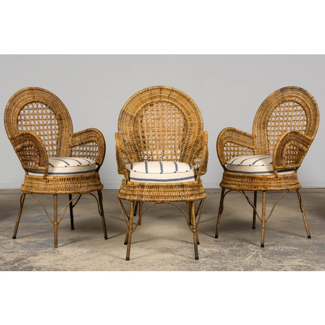Sourced from Châteauneuf-les-Martigues in Provence, France, this elegant set of six French Riviera dining armchairs...