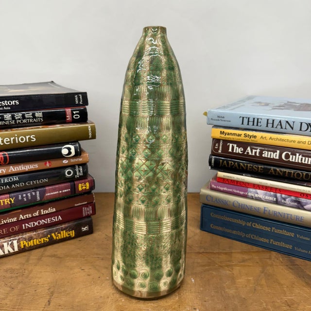 "About This Piece About This Piece A vase that feels alive with texture and movement, this hand-glazed piece draws the eye...