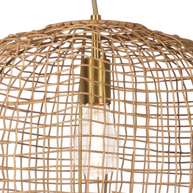With a nod to loosely woven seaside baskets, The Small Selene Pendant is a study in minimalism—with maximal illumination....