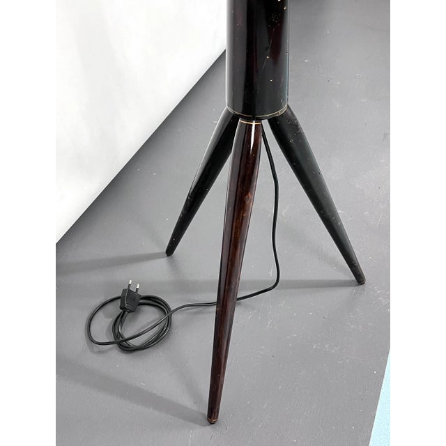 Good original vintage condition with trace of age and use for this tripod floor lamp made from wood and produced in Italy...