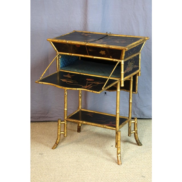 Napoleon III period side table in giltwood in a bamboo style with lacquer panels decorated with flowers and birds. A...
