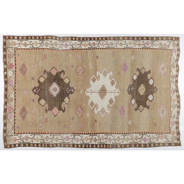 This vintage Kars rug is an exceptional example of Eastern Anatolian weaving, celebrated for its earthy neutrals,...