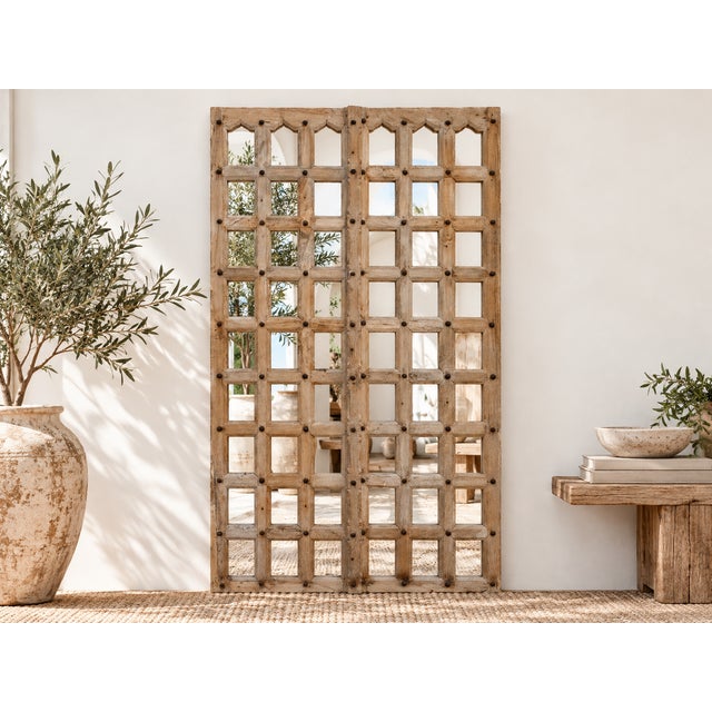 Imagine the stories these striking mirror panels could tell. Originally a pair of substantial antique doors, hailing from...