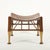 A stylish 20th century interpretation of the classic Egyptian Thebes stool, featuring a gently curved, saddle-shaped...