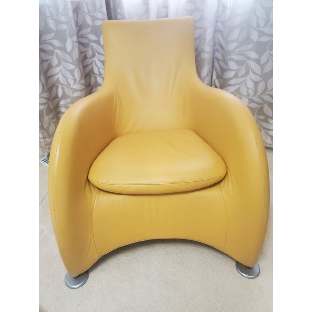 This modern lounge chair in yellow leather designed by Gerard Van Berg for Montis is a unique blend of style and comfort....
