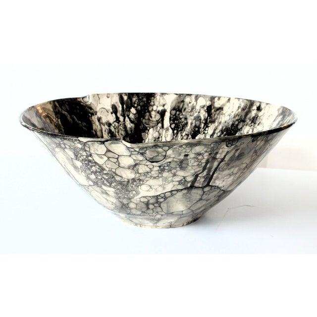 1960's Contemporary pottery bowl signed by artist. Unique black and white bubble/oil spot glaze. A functional piece of...