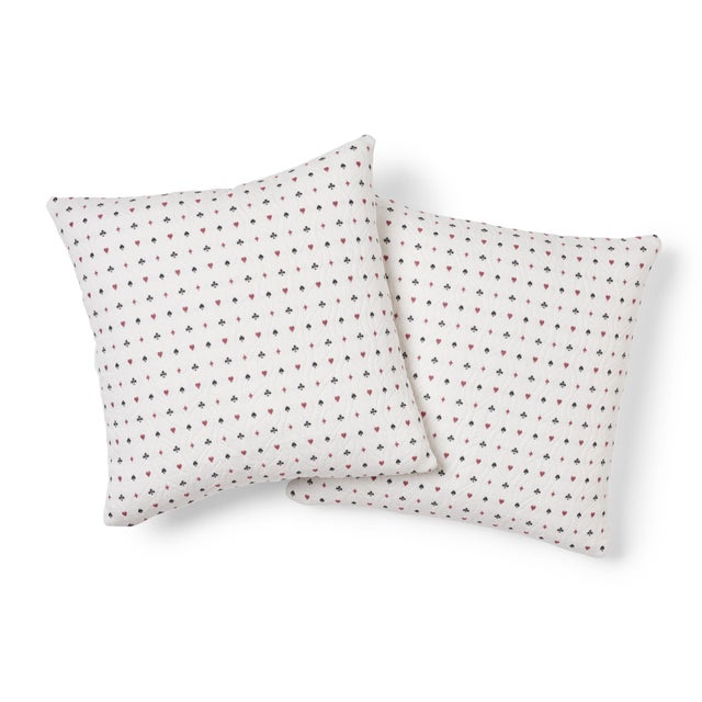 This pillow features Le Joueur with a Knife Edge finish. A winning hand of hearts, spades, diamonds and clubs animates Le...