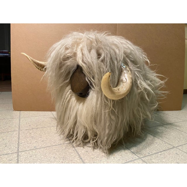 This is an absolutely fantastic footstool or ottoman. It is in the form of a woolly lamb or sheep. It has a very long fur...