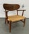 Pair of mid century project CH22 lounge chairs by Hans Wegner for Carl Hansen. Each chair is in need of new paper cord...