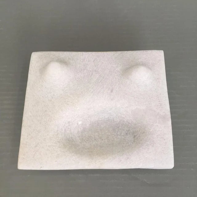Cat face hand carved marble sculpture by tom von kaenel dimensions: d14 x w16 x h4 cm materials: marble. this piece is...