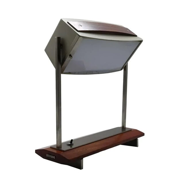 Table lamp mod. 8063. Nickel-plated brass, painted metal, glass diffuser, wood. Production Stilnovo 1960s. Stilnovo mark...