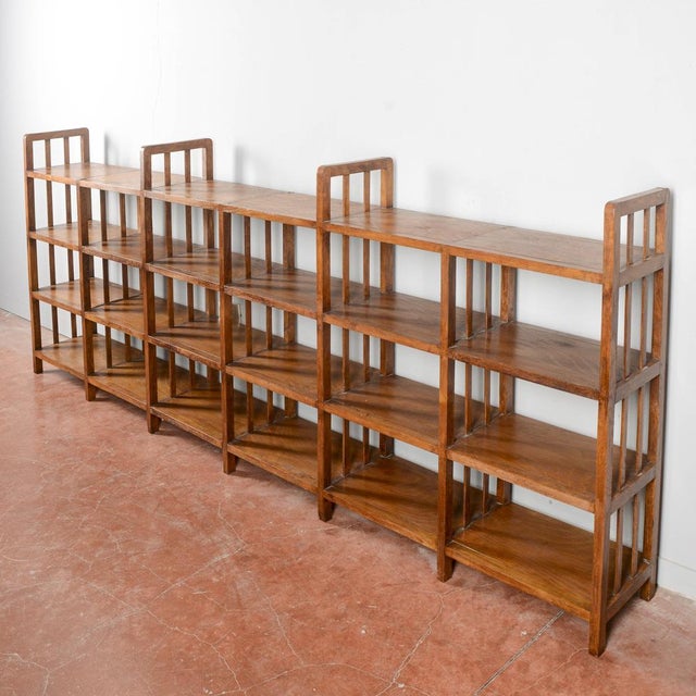 This spacious bookcase/document cabinet, with its austere and functional design, recalls vintage ministerial or office...