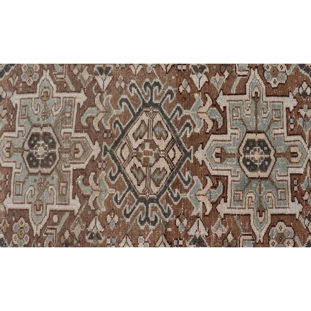 Textile Antique Persian Heriz Rug With Geometric Medallion Design in Mocha, Blue, & Tan For Sale - Image 7 of 12