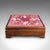 This is an antique upholstered footstool. An English, pitch pine fireside or lounge stool, dating to the Edwardian period,...