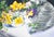 Why This Work Matters Parry gives the traditional spring bouquet a striking modern edge, pairing radiant daffodils and...