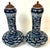 Pair of Late Qing Blue and White Porcelain Garlic-Neck Vases with Lion Mask Handles and Hardwood Covers A striking and...