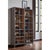 A 75-inch steel frame surrounds soft gray acacia, with one sculptural gunmetal handle running down the glazed door....