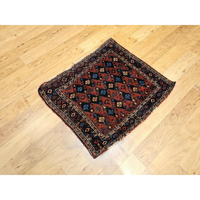 "Discover a captivating piece of tribal history with this Early 20th Century Persian Kurdish Tribal Bagface, now...