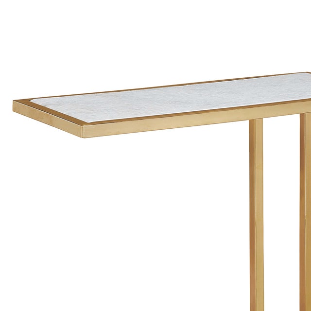 At home in a variety of decors, the Echelon sofa hugger table pairs white marble slab with a natural brass iron frame....