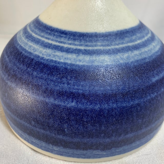 This is a vintage Raymor Sgrafo White and Blue Stripe Vase featuring a striking two-tone glazed finish with banded blue...