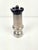 This is a vintage French pepper mill made of pewter and black wood, designed in the shape of a chess Tower