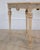 A charming Swedish Gustavian console table dating to circa 1860, featuring beautifully carved neoclassical decoration and...