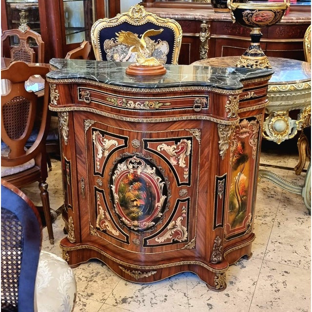 This magnificent French Louis XVI commode is a true masterpiece, featuring exquisite marquetry, intricate craftsmanship,...