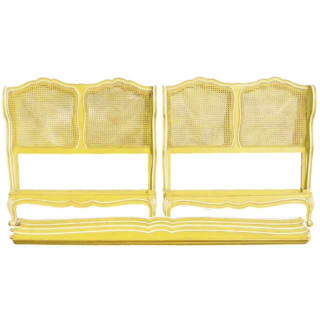 Charming pair of Louis XV inspired twin beds consisting of a painted bedframe complete with headboards, footboards, and...