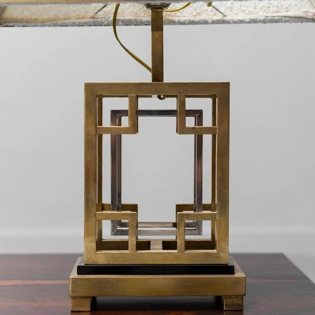 70s table lamp. Base and golden metal structure. Bouclé lampshade with metal inserts. Fully functional. Good condition,...