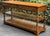 A late 20th century Pennsylvania House American Traditional solid oak console or sofa table having two drawers with brass...