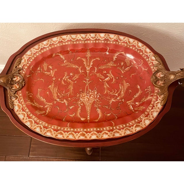 Vintage Sarreid Neoclassical Style Red Porcelain and Brass Tray Table Make a sophisticated statement with this striking...