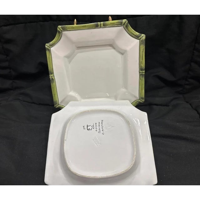 The Vintage Costa Italy Hand Painted Ceramic Set of 2 square plates is a unique and charming addition to any kitchen or...