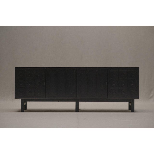 mpressive Brutalist sideboard in black patinated oak circa 1970s, Belgium. Often attributed to De Coene. This...
