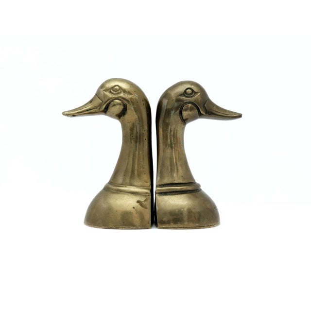 Vintage brass duck bookends- set of 2 This listing is for a set of brass bookends; duck heads. Place these lovely birds on...