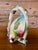 A charming vintage Japanese ceramic wall pocket featuring a colorful tropical parrot perched within a faux bamboo arch...