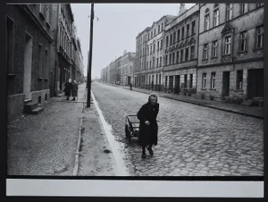 Elder Woman Walking Down the Street with Her Handcart by Rolf Gillhausen, 1940s